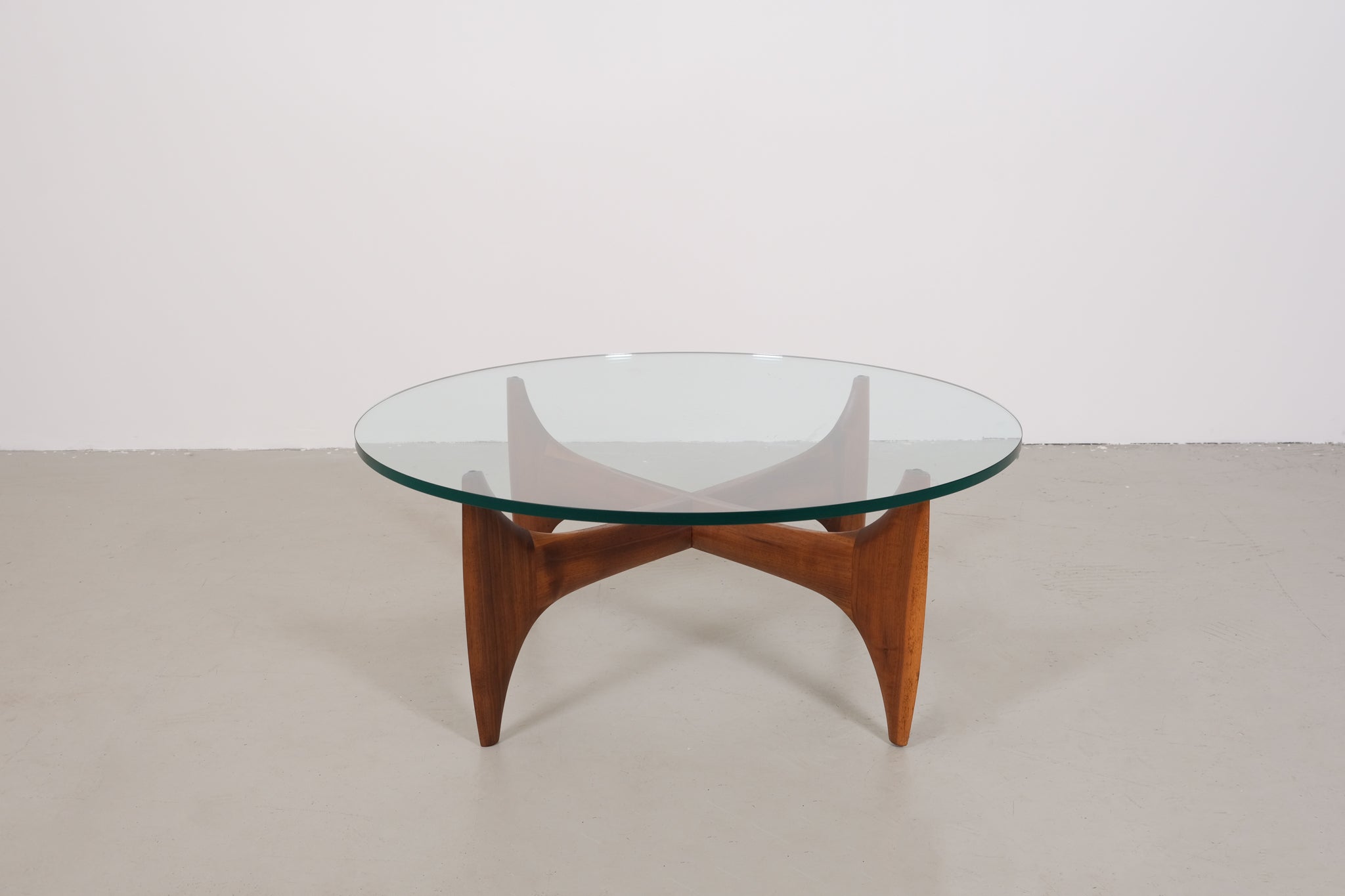 Vintage mid-century coffee table with teak base and glass top